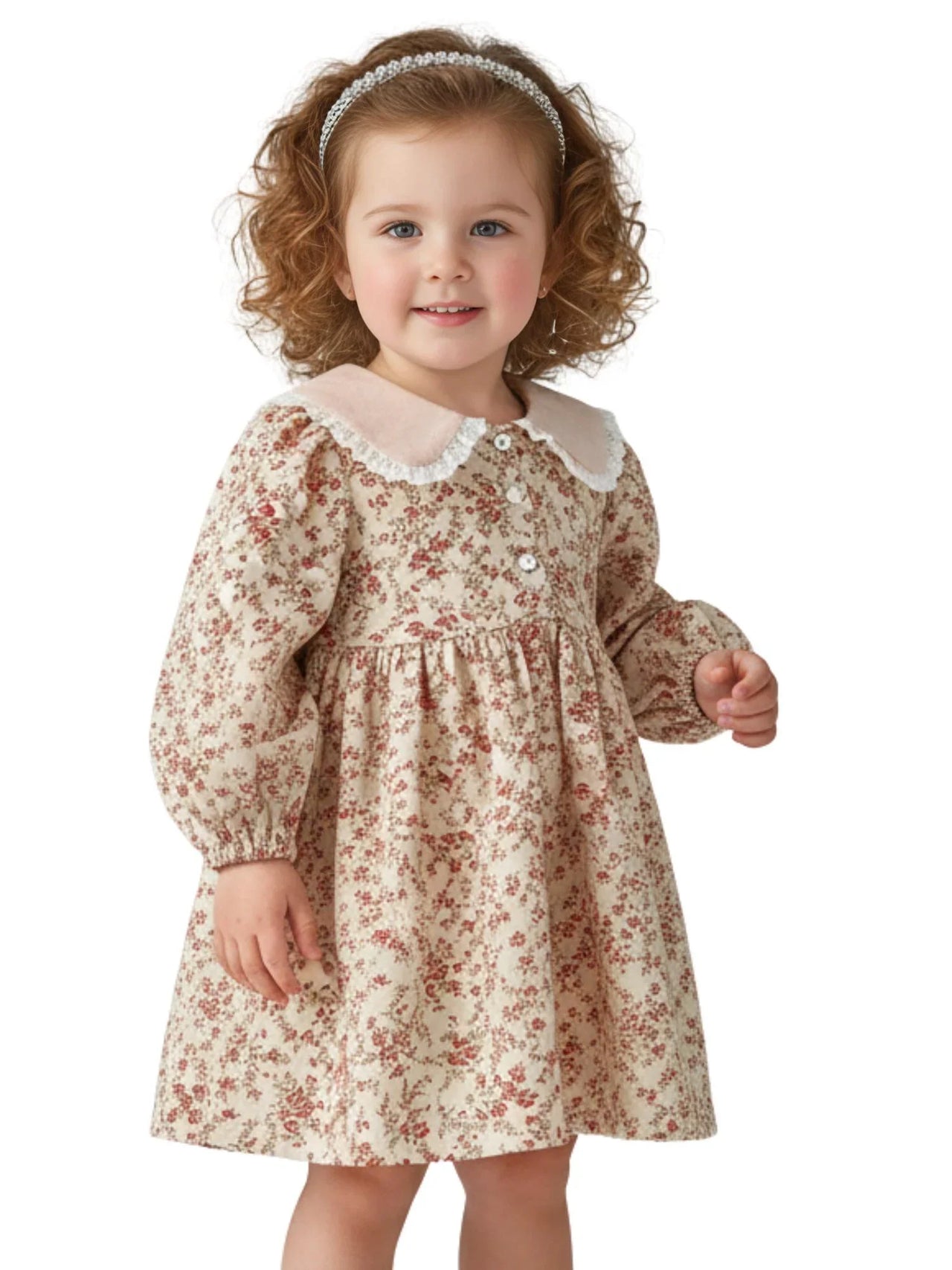 Young girl wearing a vintage floral dress with a white doll collar on a white background