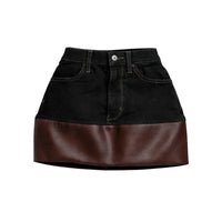 Thumbnail for Black denim skirt with brown leather patchwork on a white background