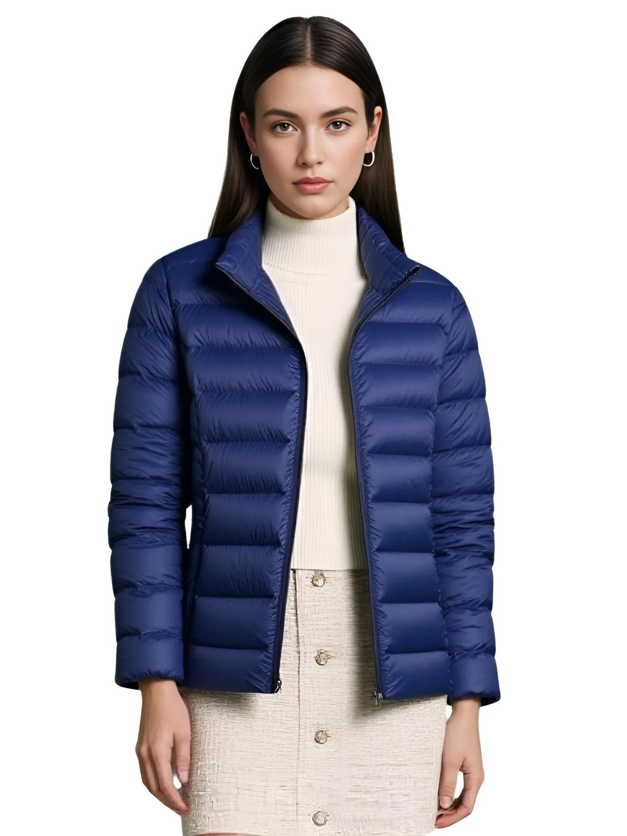 Woman wearing a navy blue puffer jacket on a white background