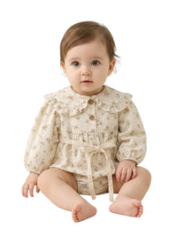 Thumbnail for Baby wearing a cream floral romper with a white background