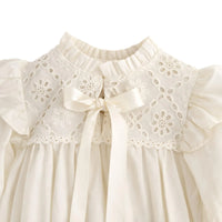 Thumbnail for Antique white baby romper with floral lace details and bow accent on a white background