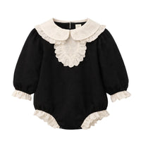 Thumbnail for Black baby romper with white lace collar and cuffs on a white background