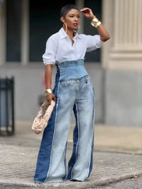 Thumbnail for Woman wearing a white shirt and blue patchwork jeans with a blurred background