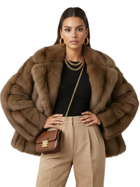 Thumbnail for Woman wearing a brown faux fur coat with a matching handbag on a white background