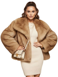 Thumbnail for Woman wearing a camel colored faux fur coat and white dress with a handbag on a white background