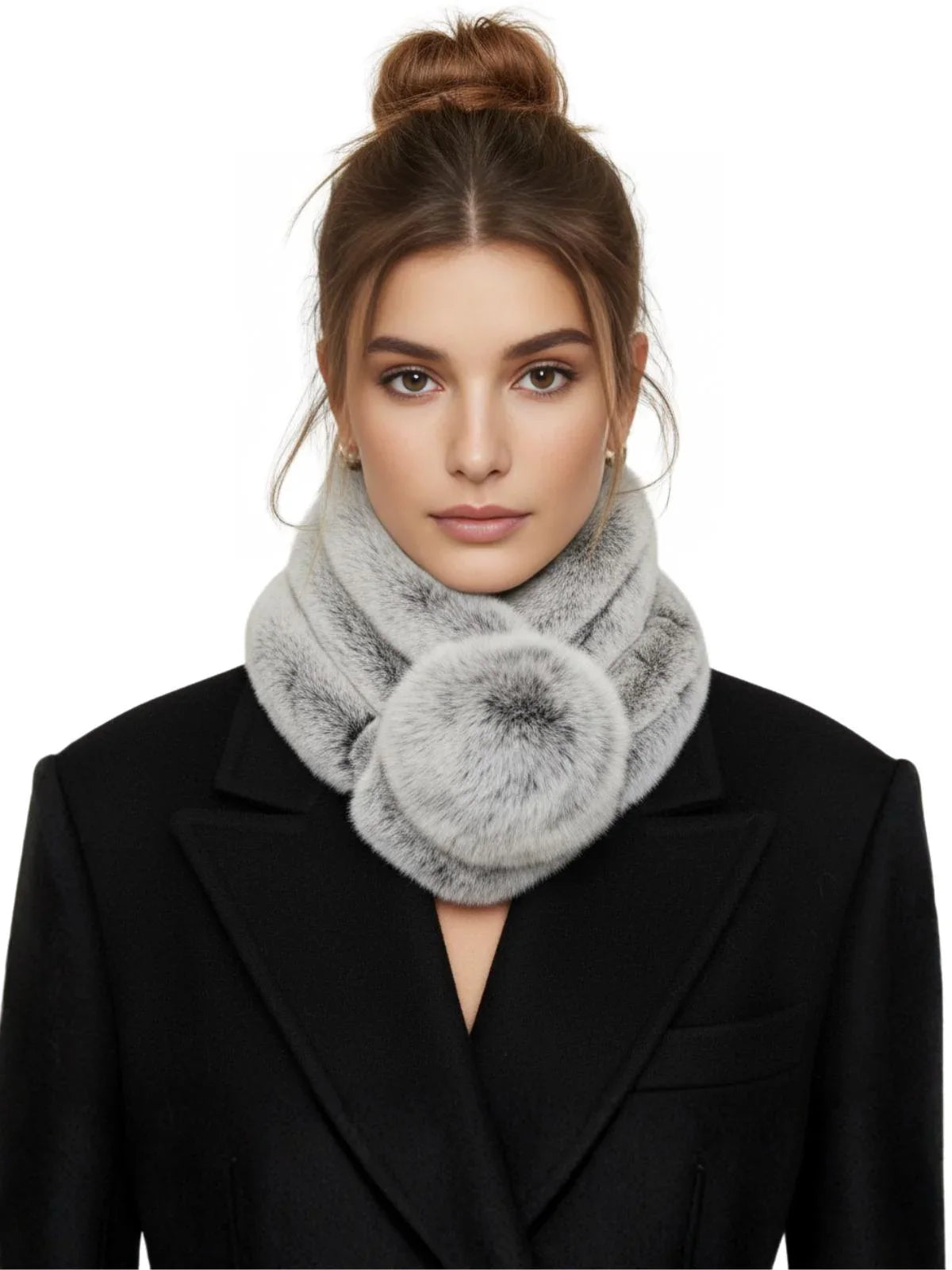 Woman wearing a grey rabbit fur scarf with pom-poms on a white background