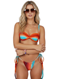 Thumbnail for Woman wearing an orange and blue bikini and sunglasses on a white background