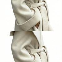 Thumbnail for Close-up of a long white waterfall coat with a belt on a white background