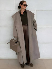 Thumbnail for Woman wearing a long camel waterfall coat with belt and shawl lapel on a white background