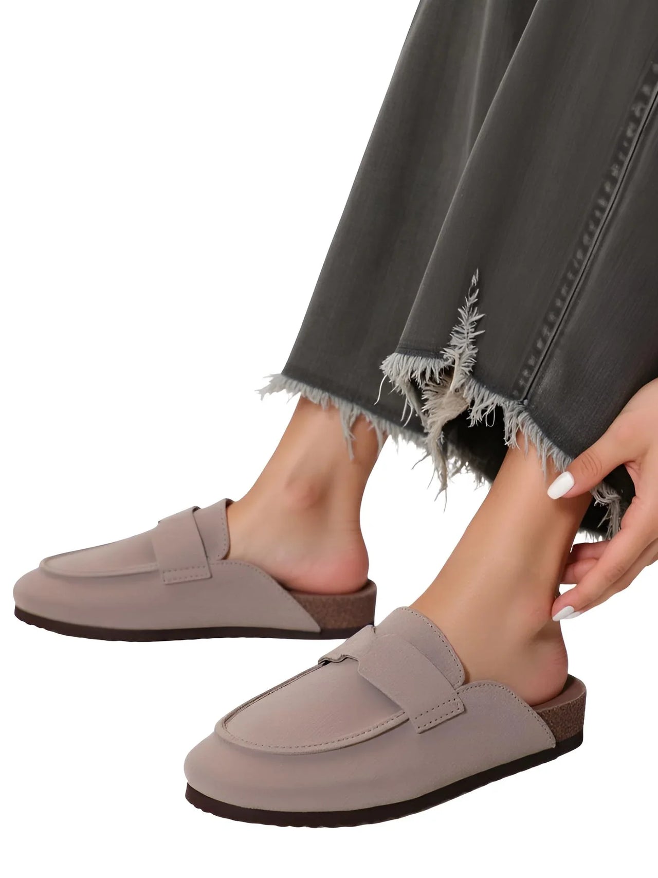 Pair of women's Birkenstock style suede sandals on a white background