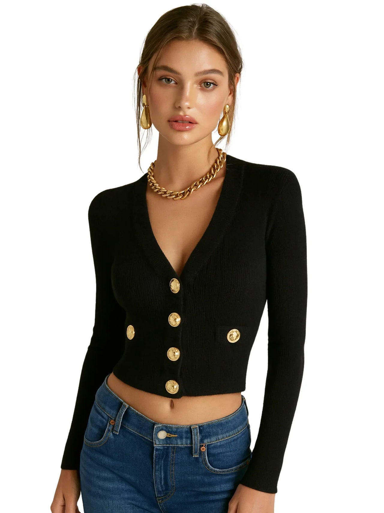 Woman wearing a black cardigan with gold buttons and blue jeans on a white background
