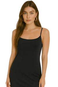 Thumbnail for Woman wearing a black slip dress on a white background