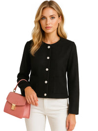 Thumbnail for Woman wearing a black tweed jacket with white buttons, holding a pink handbag on a white background