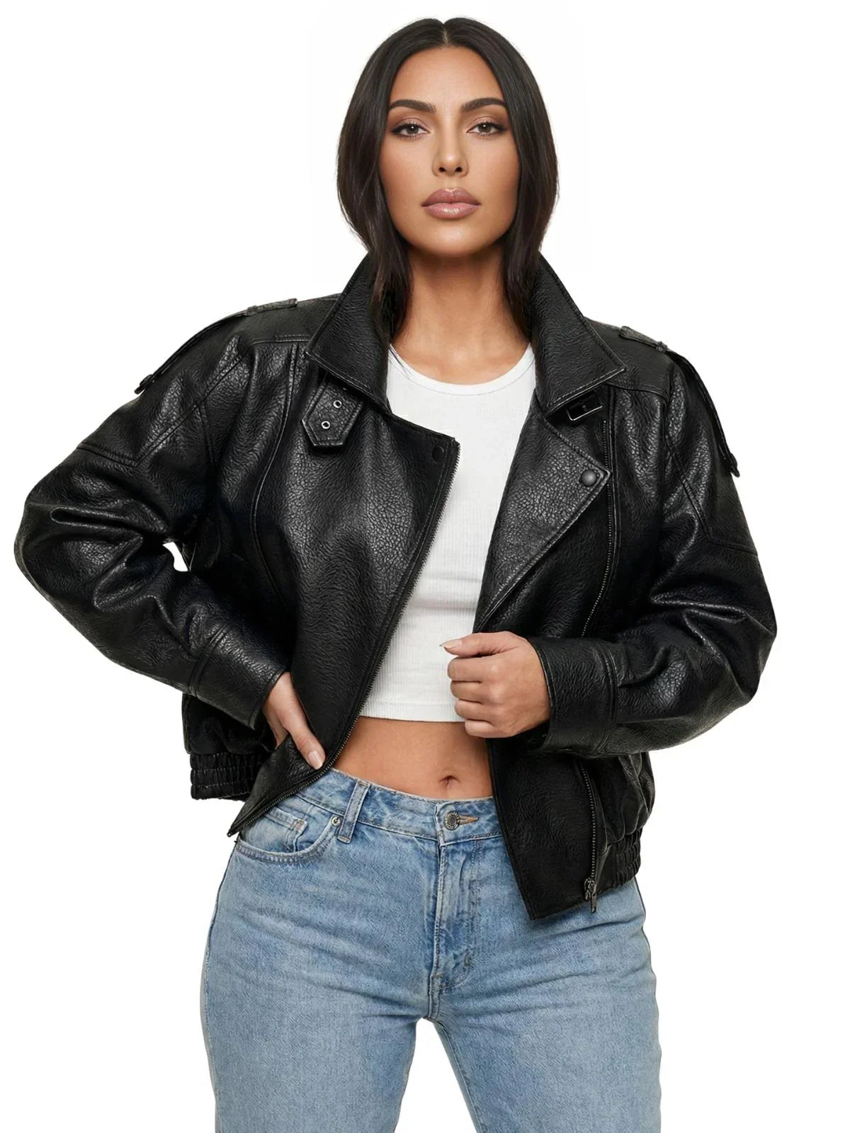 Woman wearing a black leather jacket and blue jeans on a white background