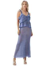 Thumbnail for Woman wearing a blue ruffled skirt set on a white background