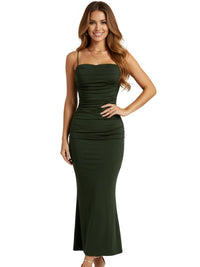 Thumbnail for Woman wearing a green dress on a white background