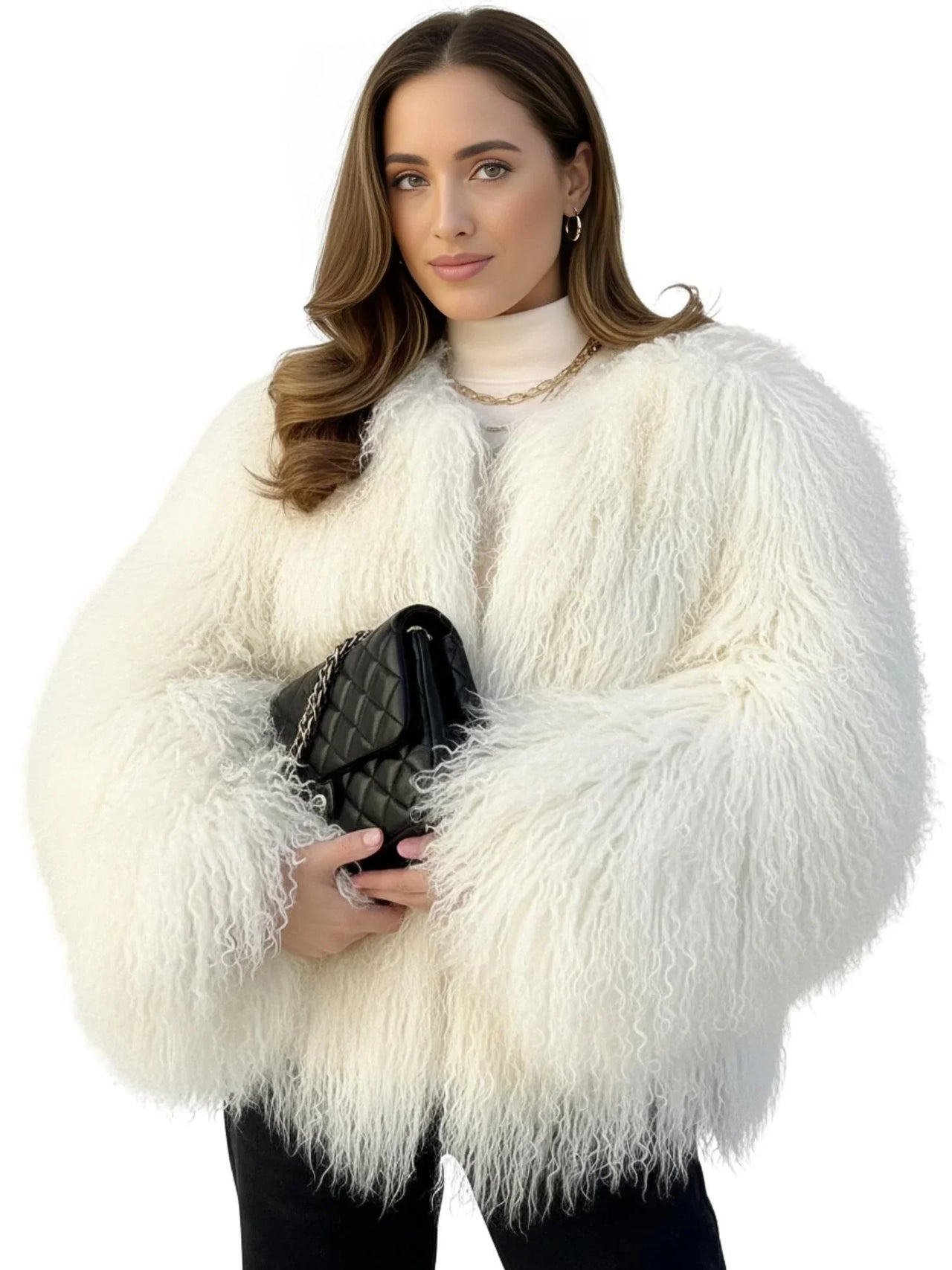 Woman wearing a white fluffy faux fur coat holding a black handbag on a white background