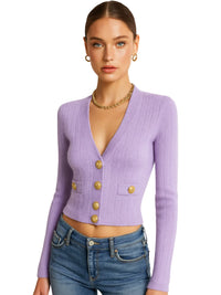 Thumbnail for Woman wearing a purple cardigan with gold buttons on a white background