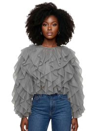 Thumbnail for Woman wearing a grey ruffled top and blue jeans on a white background
