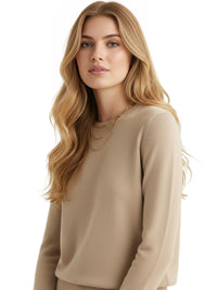Thumbnail for Woman wearing a khaki sweater on a white background