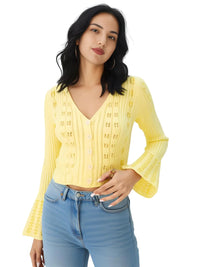 Thumbnail for Woman wearing a yellow knitted top and blue jeans on a white background