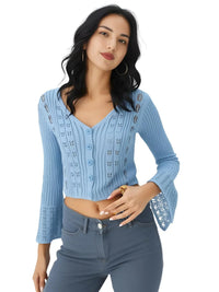 Thumbnail for Woman wearing a blue knitted cardigan and jeans on a white background