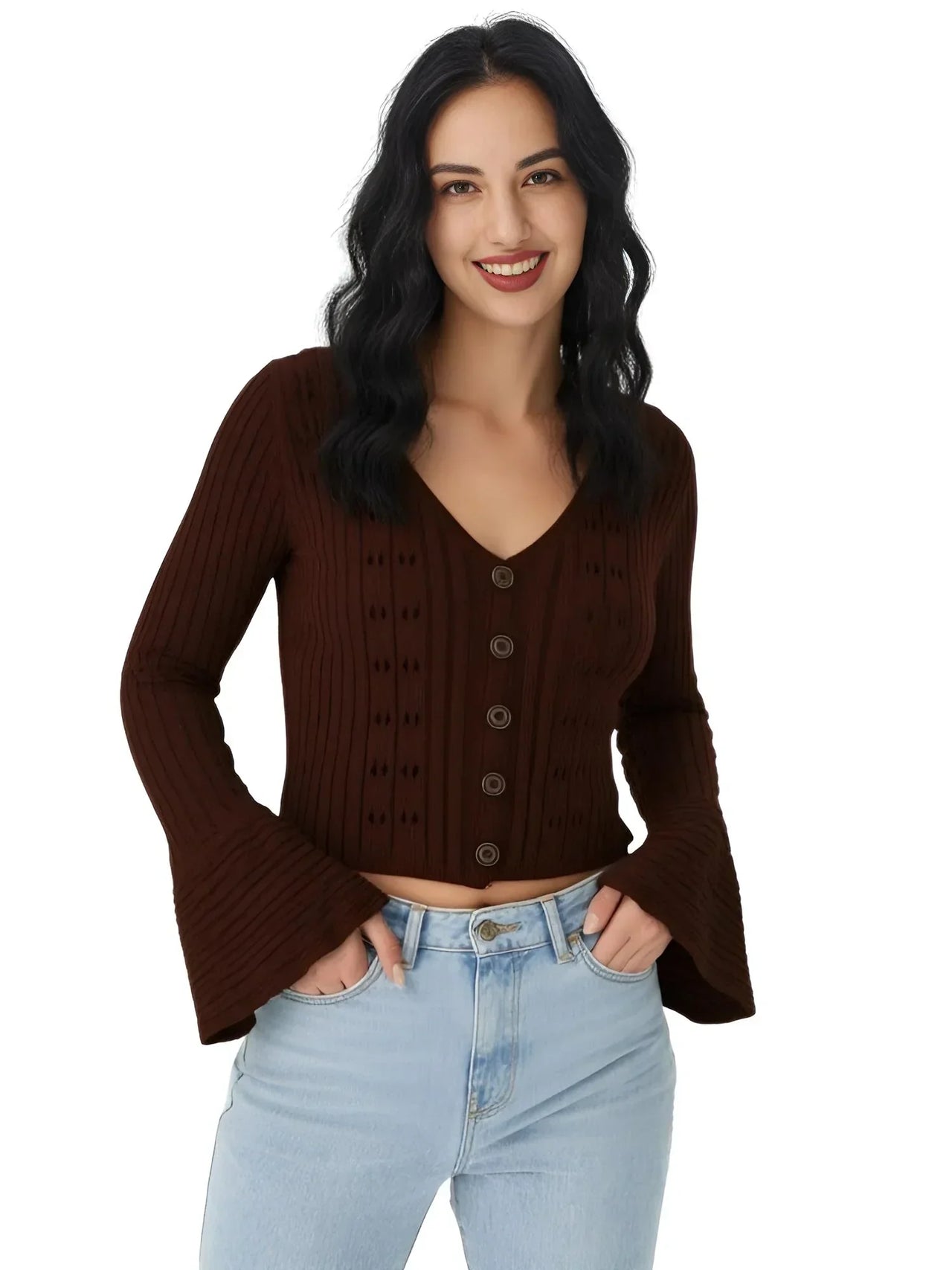 Woman wearing a brown sweater and light blue jeans on a white background