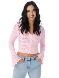 Thumbnail for Woman wearing a pink cardigan and light blue jeans on a white background