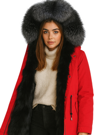 Thumbnail for Person wearing a red coat with a large fur hood on a white background
