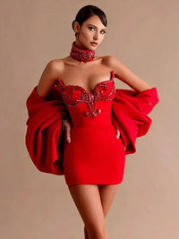 Thumbnail for Woman wearing a red mini dress with embellishments on a beige background