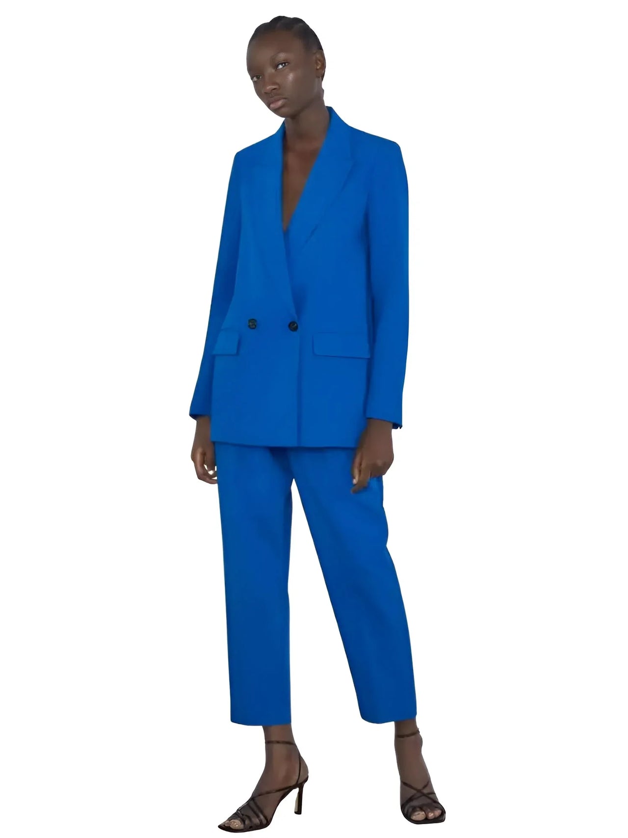 Woman wearing a blue blazer on a white background