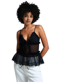 Thumbnail for Woman wearing a black ruffled top with sheer layers on a white background