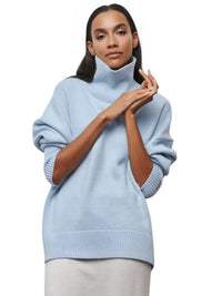 Thumbnail for Woman wearing a light blue turtleneck sweater on a white background