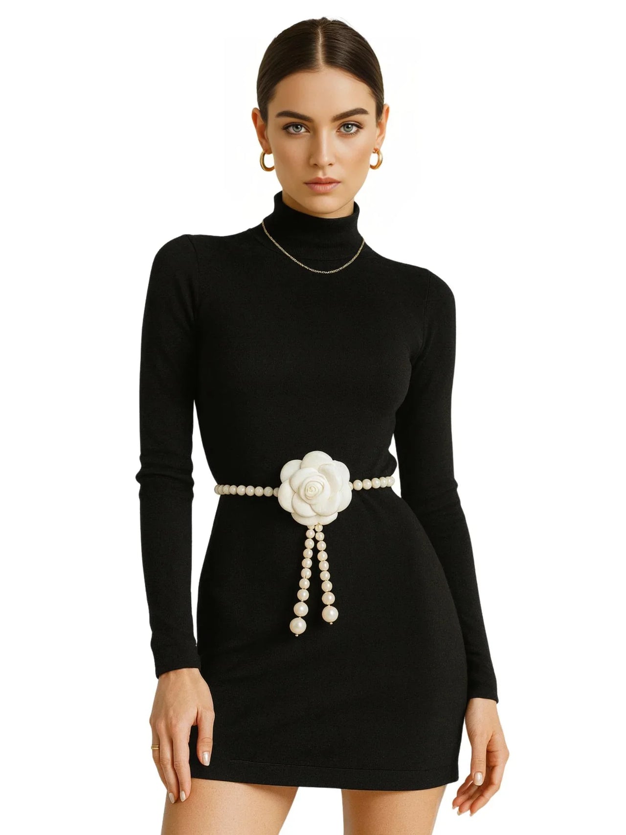 Black dress with a pearl waist belt featuring a camellia flower on a white background