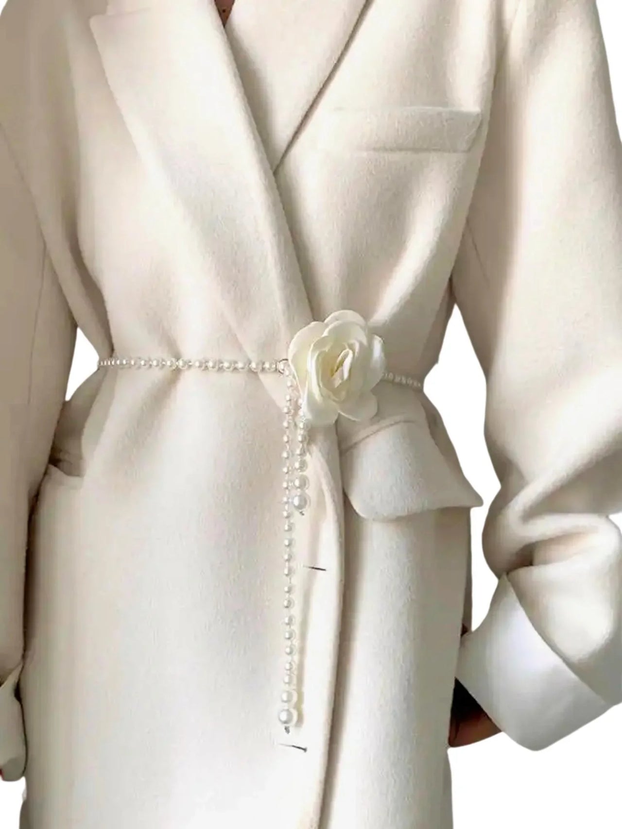 White coat with a decorative pearl belt with a white flower on a white background
