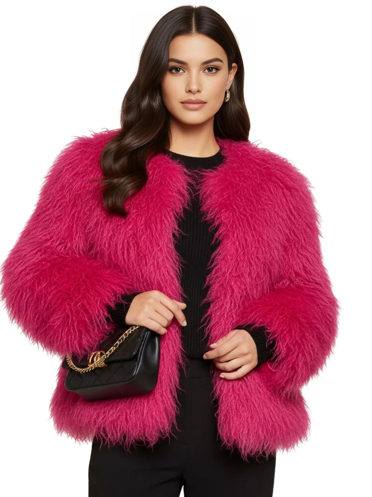 Woman wearing a bright pink faux fur coat holding a black handbag on a white background