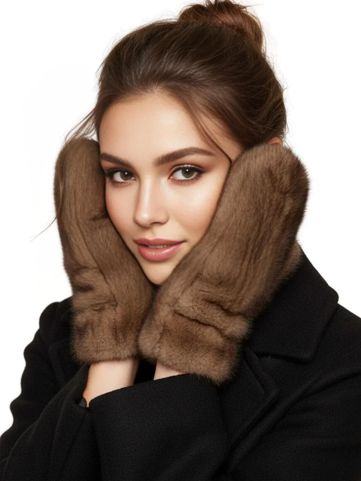 Woman wearing real mink brown fur gloves on a white background