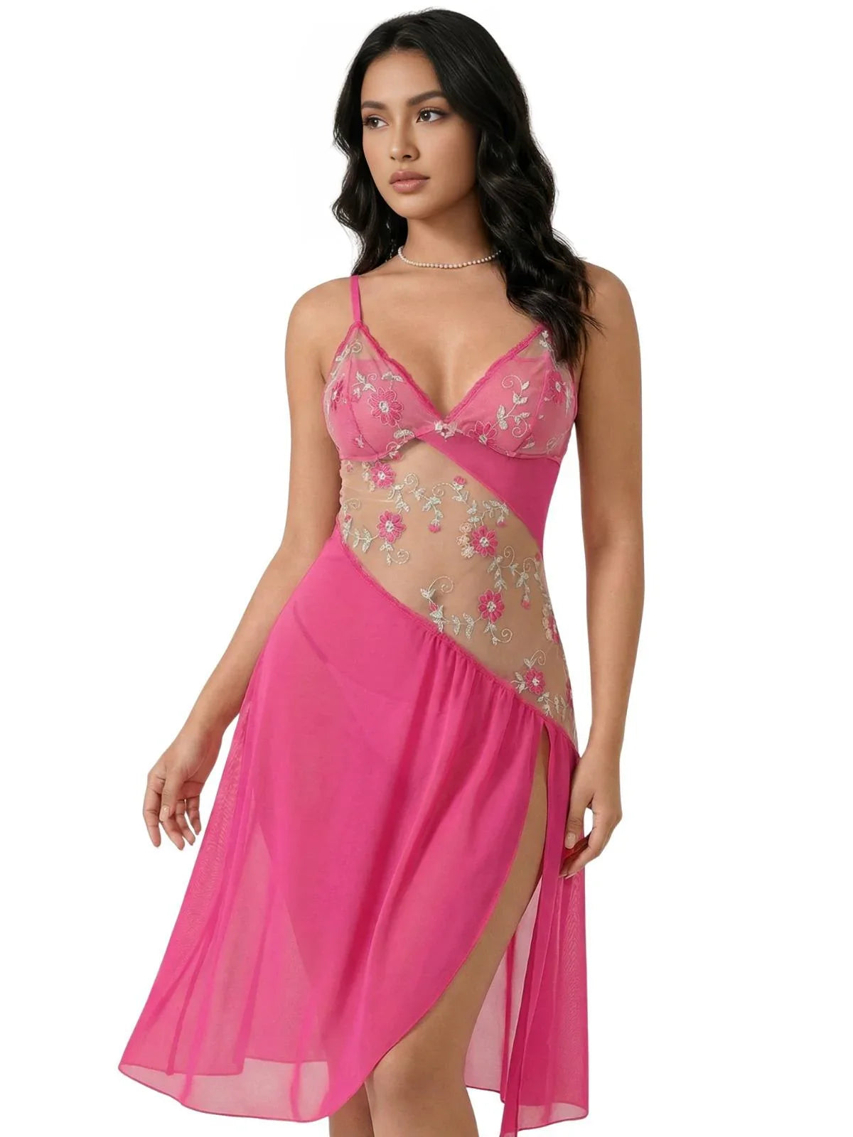 Woman wearing a short fuchsia nightgown with sheer floral embroidery lace inlay on a white background