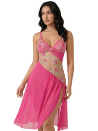 Thumbnail for Woman wearing a short fuchsia nightgown with sheer floral embroidery lace inlay on a white background