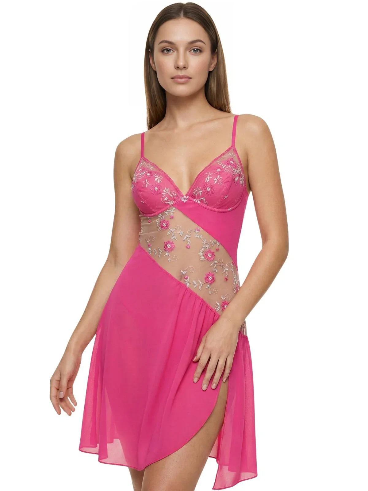 Woman wearing a short fuchsia nightgown with sheer floral embroidery lace inlay on a white background