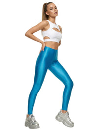 Thumbnail for Woman wearing a white sports bra and blue leggings on a white background