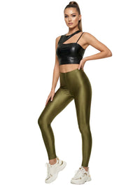 Thumbnail for Woman wearing a black crop top and green leggings on a white background