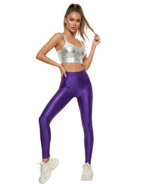 Thumbnail for Woman wearing a silver crop top and purple leggings on a white background