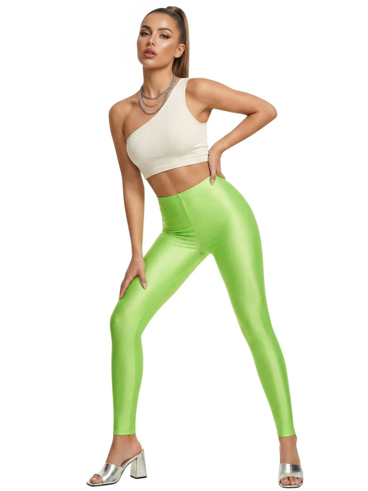 Woman wearing a white top and neon green leggings on a white background