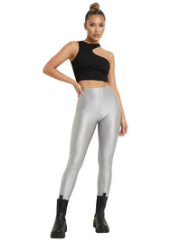Thumbnail for Woman wearing black crop top and silver leggings on a white background