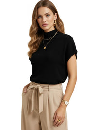 Thumbnail for Woman wearing a short sleeve black sweater and beige pants with a white background