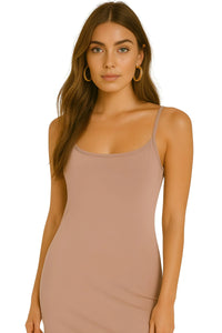 Thumbnail for Woman wearing a pink khaki slip dress against a white background