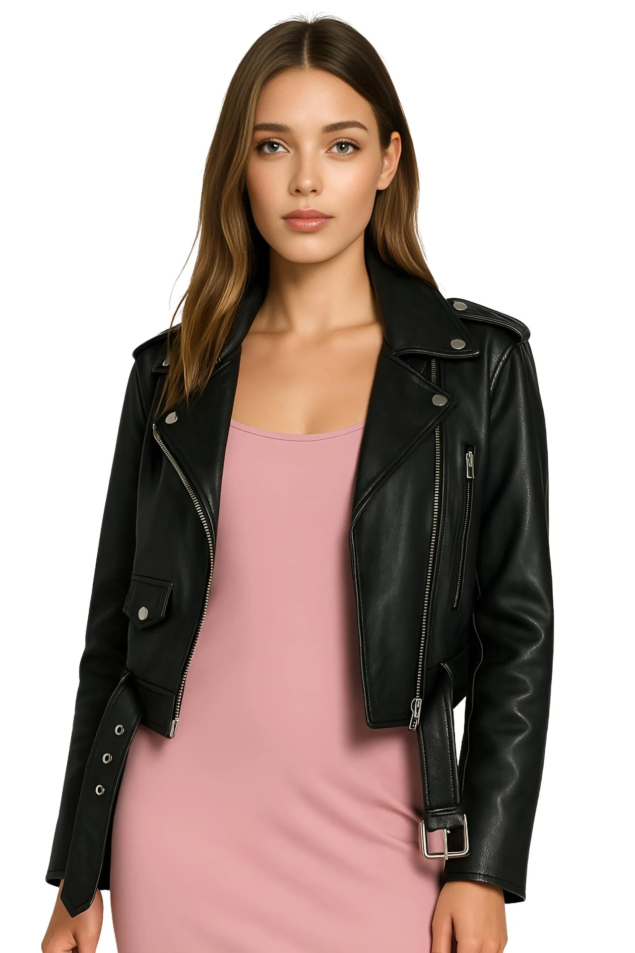 Woman wearing a black leather jacket over a pink slip dress on a white background