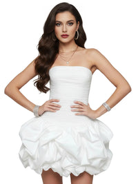 Thumbnail for Woman wearing a white strapless mini dress with ruffled skirt on a white background