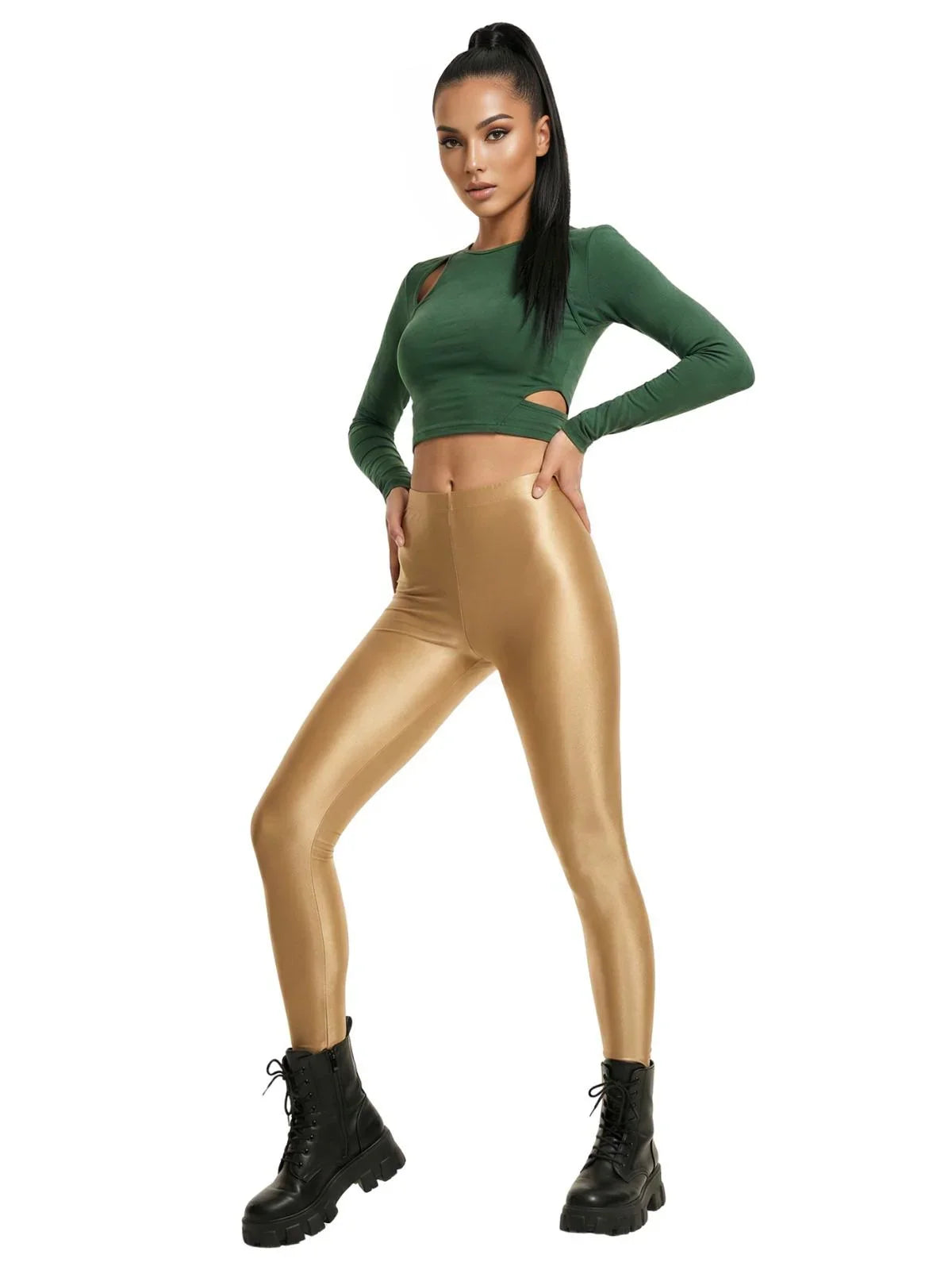 Woman wearing a green crop top and gold leggings on a white background
